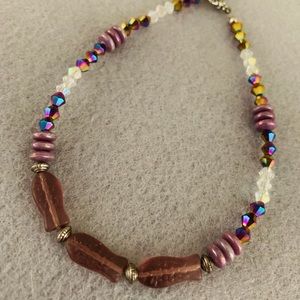 Purple peaceful fish ankle bracelet.